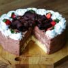 A visually enticing chocolate cake with strawberries and cream, perfect for desserts and celebrations.
